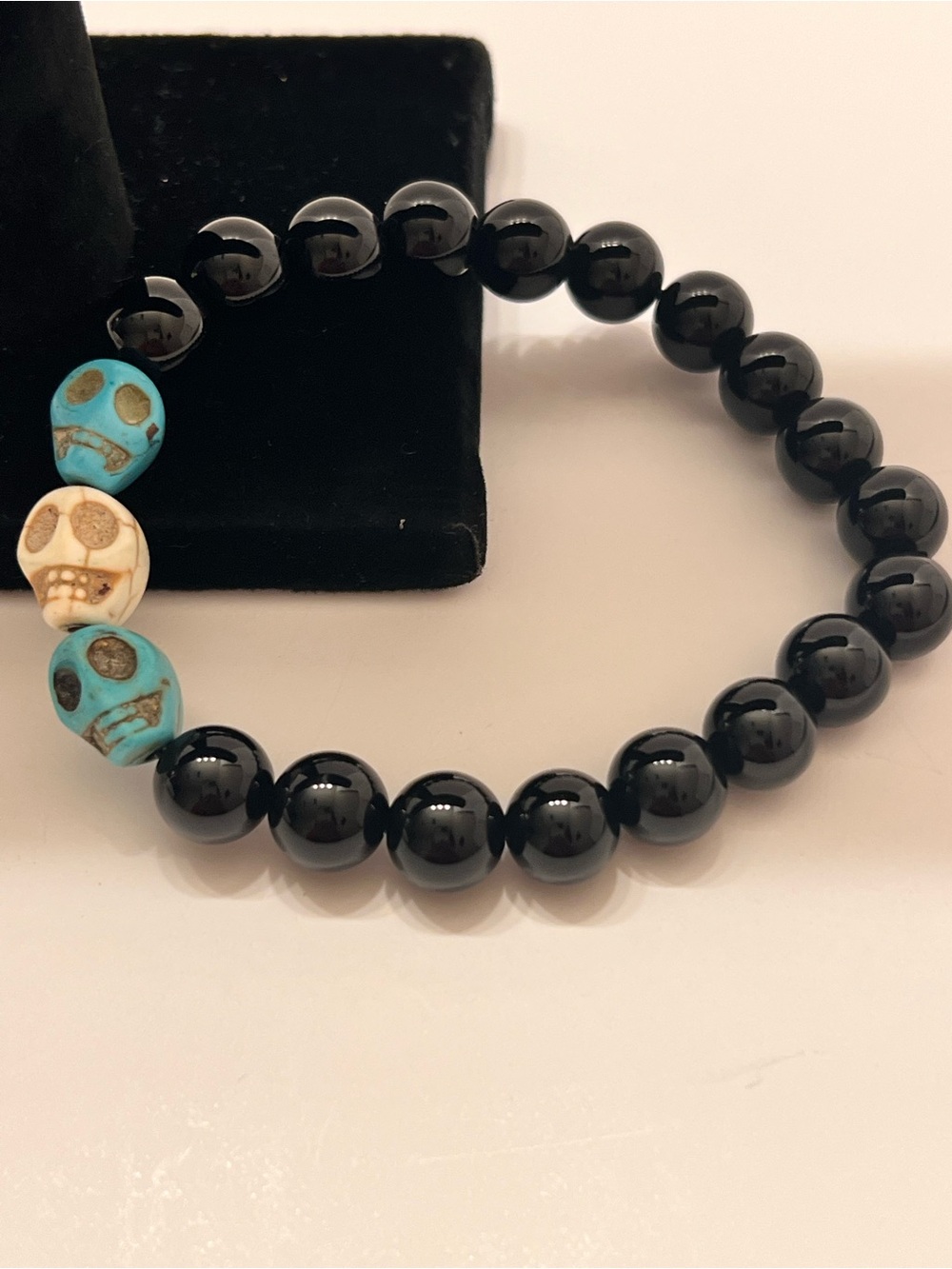 Men's Black Bead Stretch Bracelet with Turquoise and Ivory Skull Accents